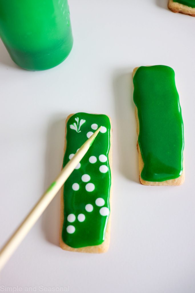 creating shamrocks with a toothpick and wet icing