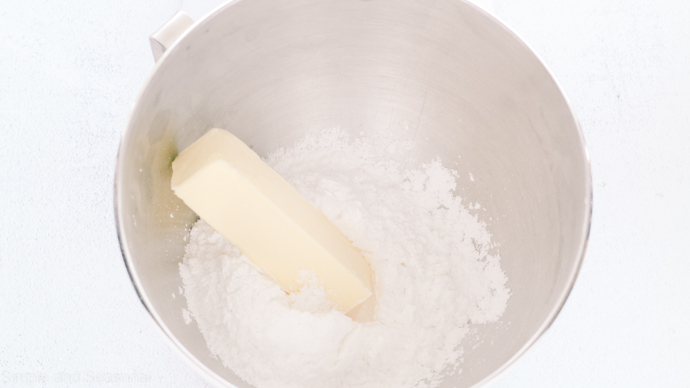 stick of butter and powdered sugar in a mixing bowl
