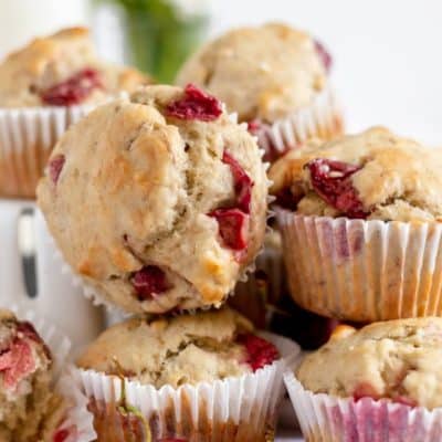 stack of muffins with fresh cherries