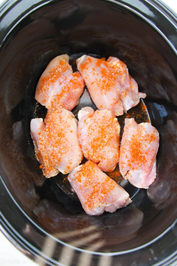 raw chicken in a slow cooker