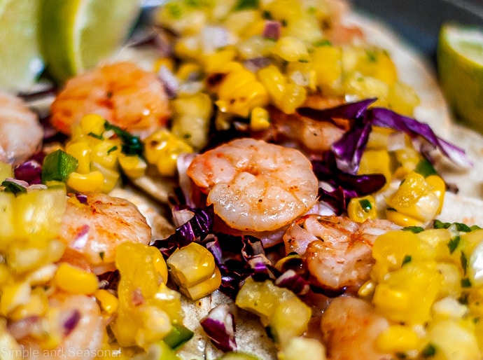 close up of shrimp with corn salsa