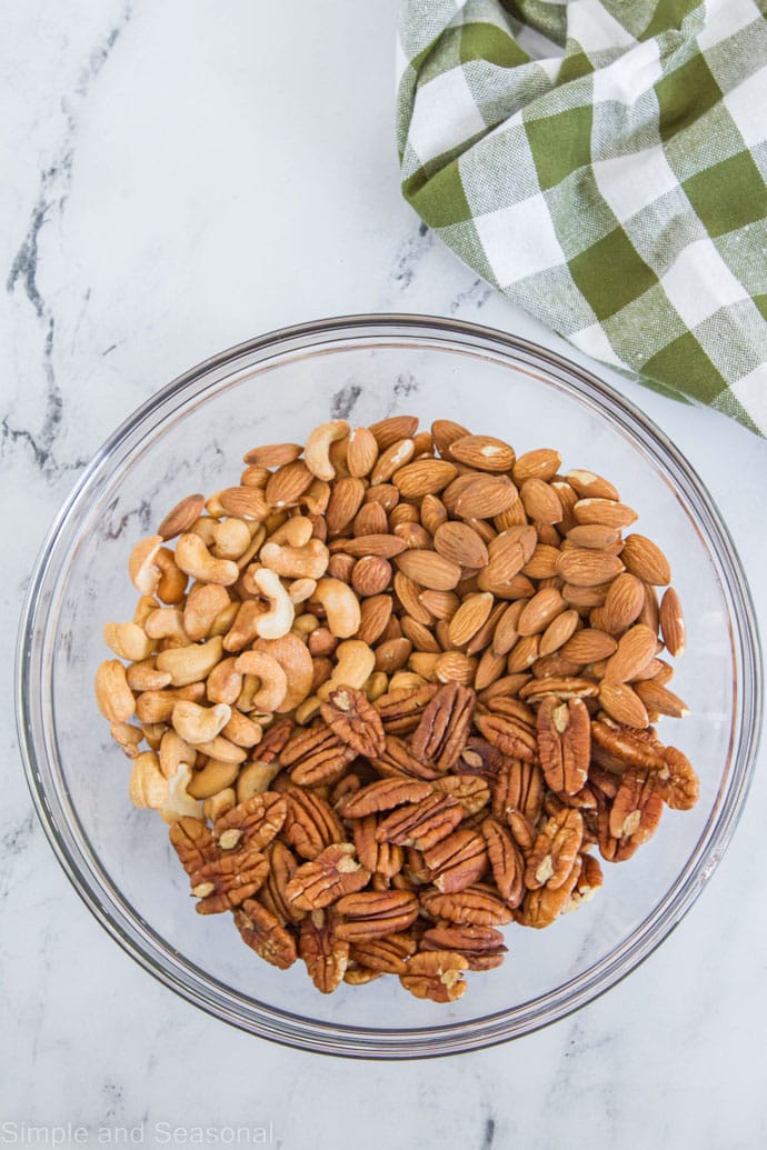 pecans, almonds and cashews in a mixing bowl