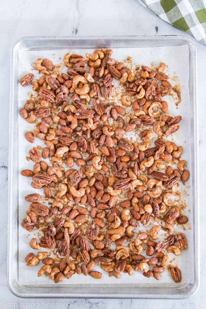 mixed nuts on a baking sheet after baking