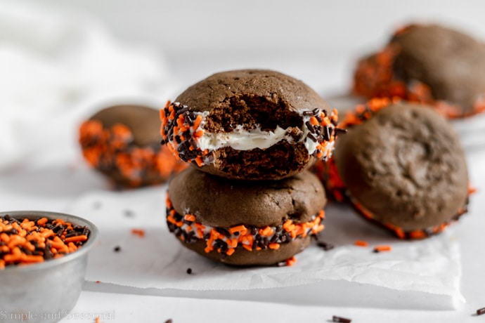 whoopie pie with bite removed to show creamy filling