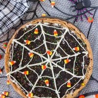 giant cookie decorated with icing to look like a spider web
