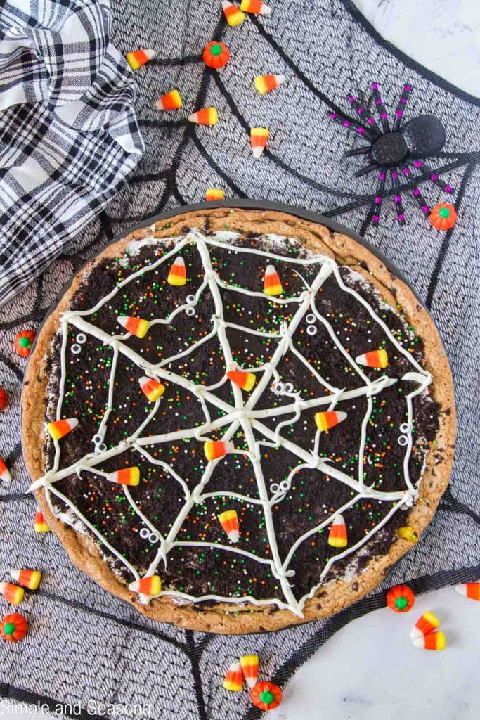 giant cookie decorated with icing to look like a spider web