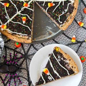 top down view of slice of cookie cake with pizza pan cookie