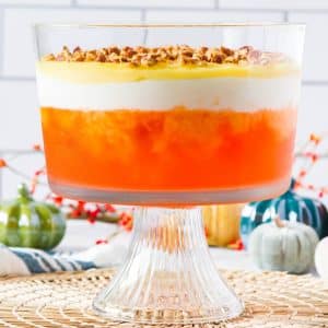 layered orange jello dessert in trifle bowl
