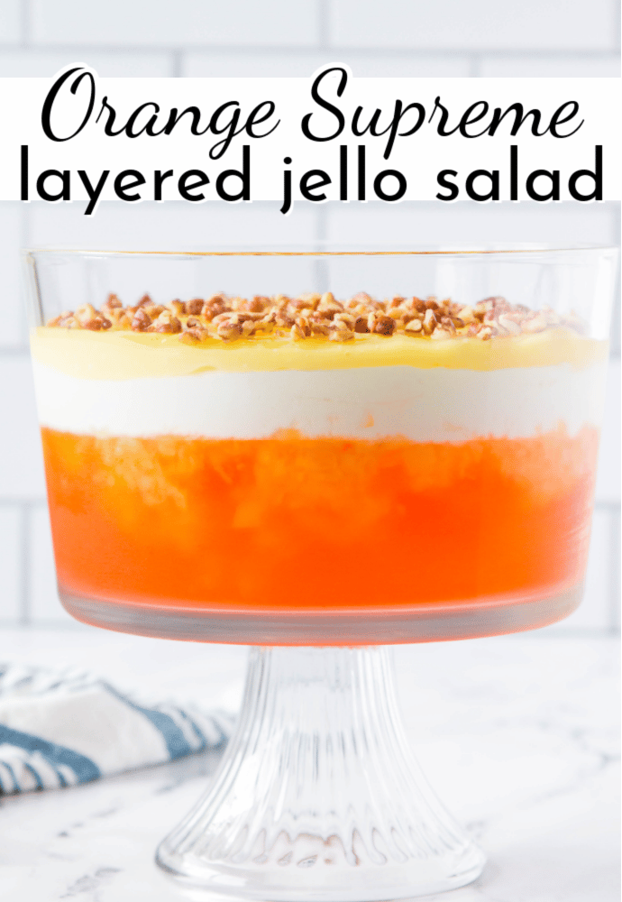 trifle dish with layered dessert; text overlay Orange Supremem layered jello salad