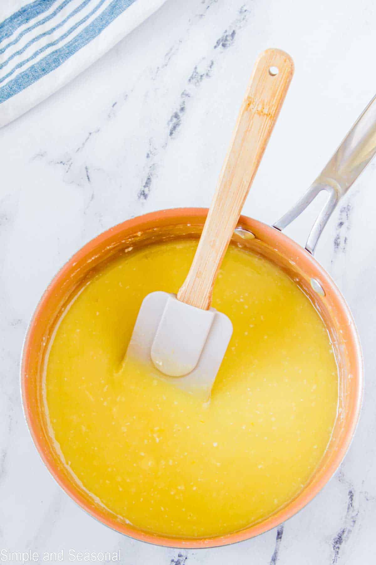 custard mixture in a bowl with a spatula