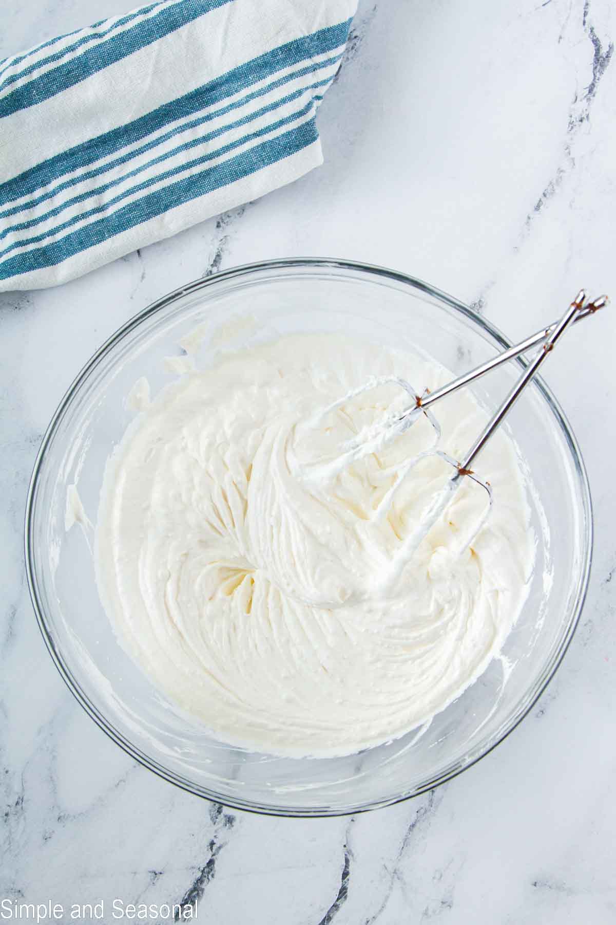 cream cheese and whipped topping in a bowl