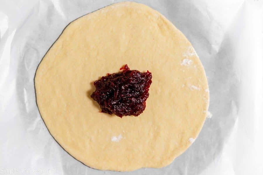 cranberry sauce filling placed onto dough layer