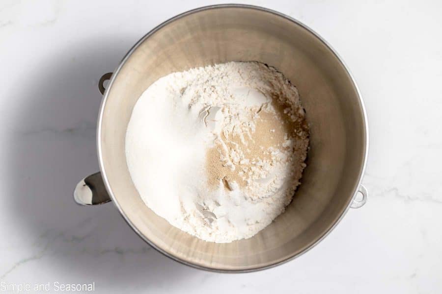 flour, sugar, yeast and salt in a mixing bowl
