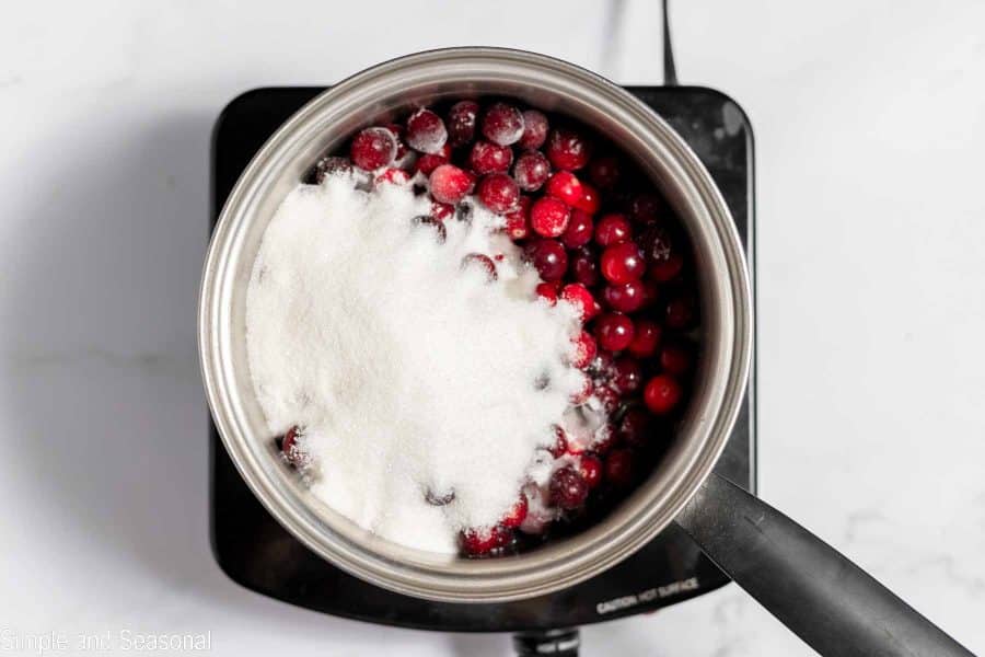cranberries and sugar in a saucepan