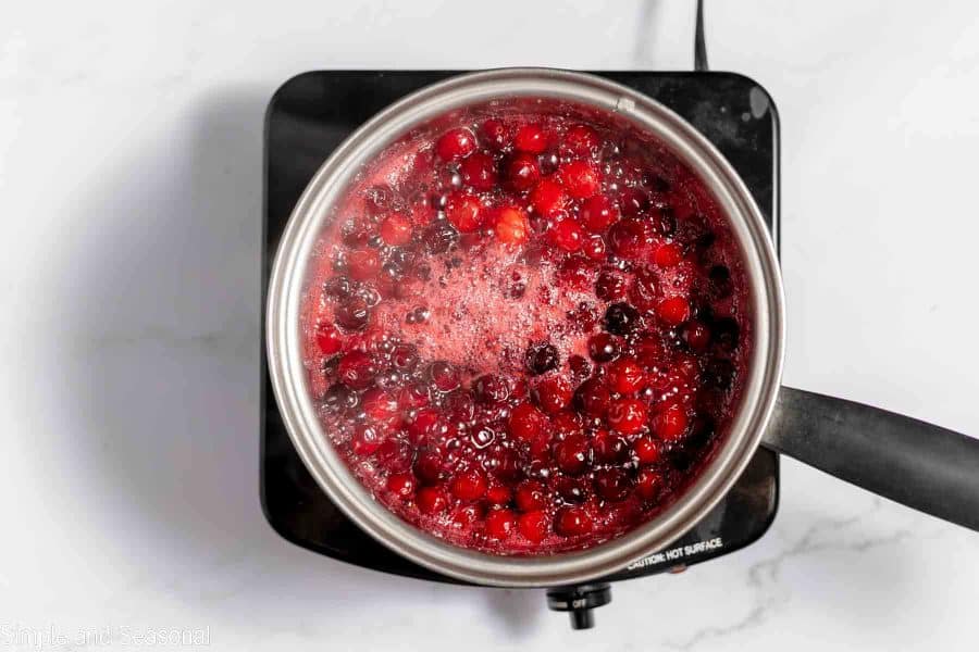 cranberry mixture boiling in the saucepan