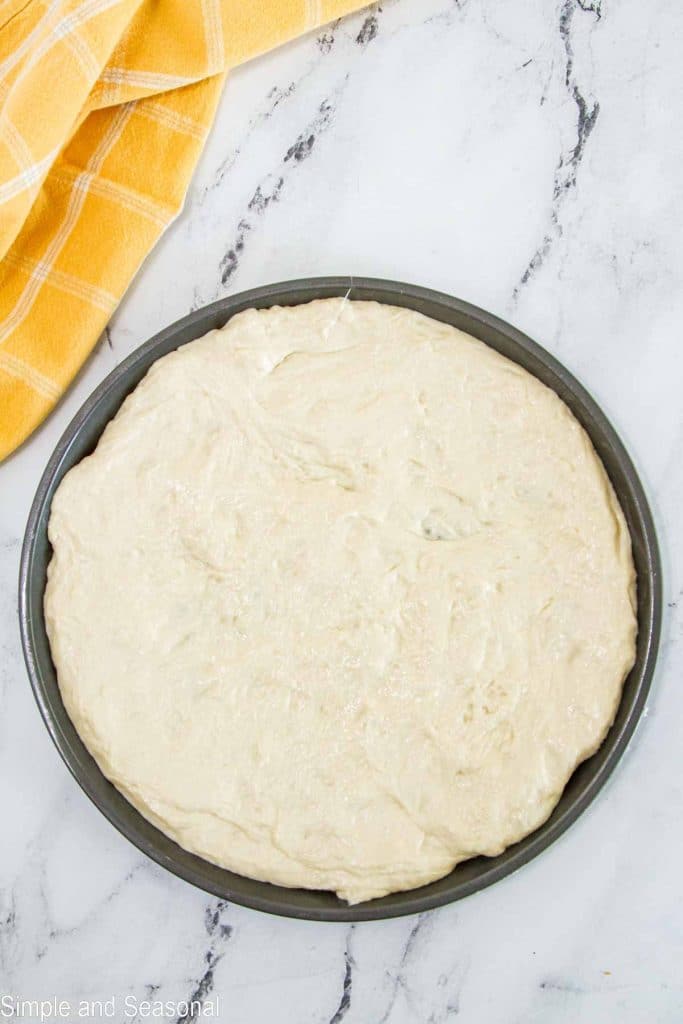 pizza dough stretch to fit inside pizza pan