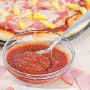 pizza sauce in a bowl with a spoon