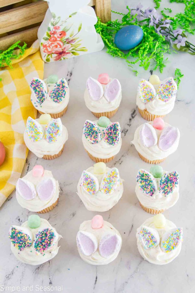 top down view of rows of bunny cupcakes with marshmallow ears and tails