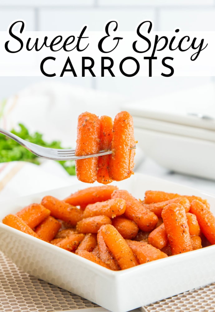forkful of cooked baby carrots with visible spices on the glaze; text overlay reads Sweet & Spicy Carrots