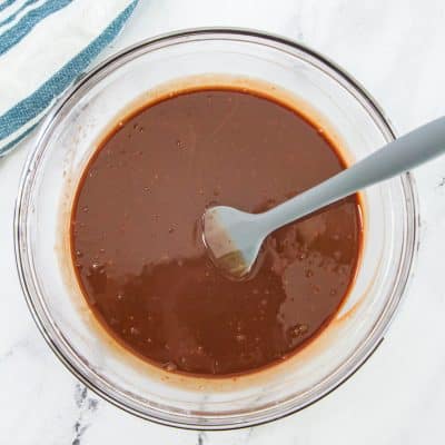 bowl of chocolate ganache with a spoon