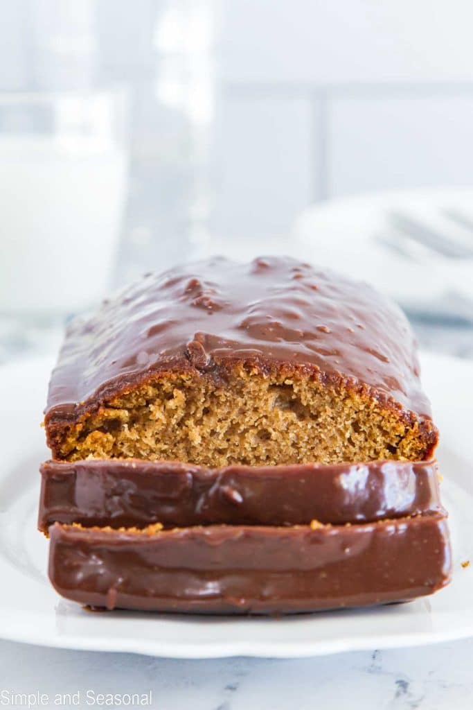 sliced pumpkin bread with shiny chocolate ganache topping