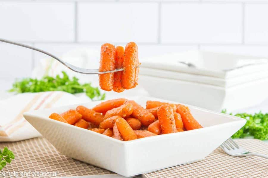 closeup of cooked spicy carrots on a fork