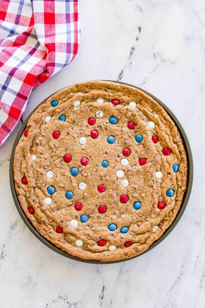 baked giant cookie on a pizza pan