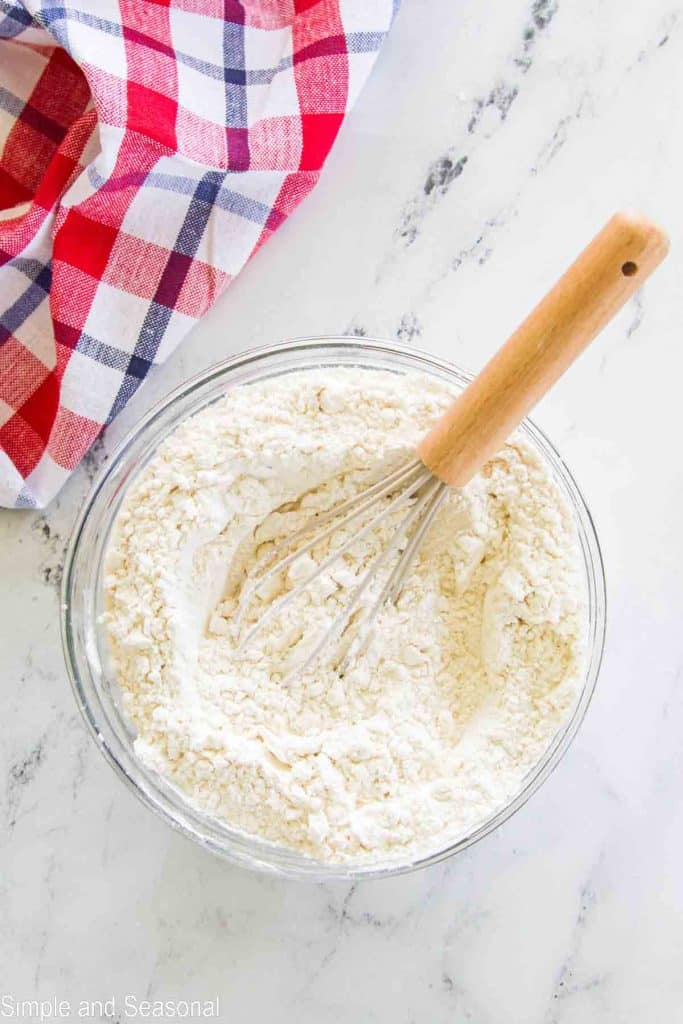 flour in bowl with whisk