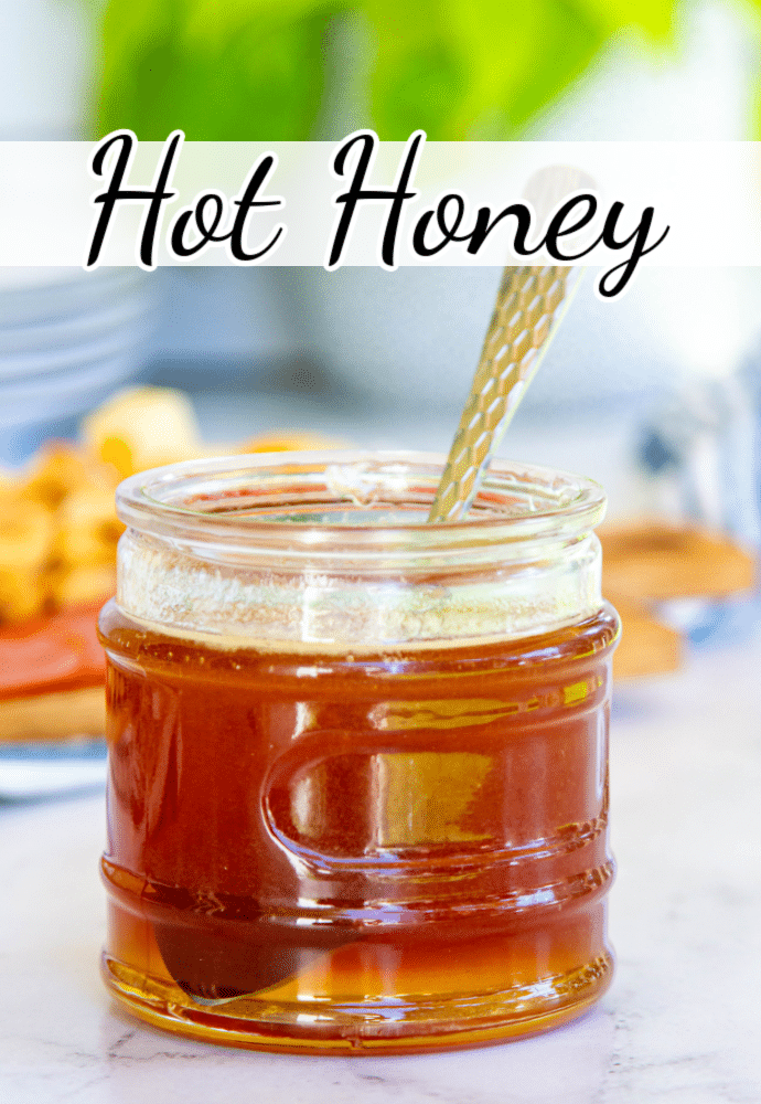 jar of honey with a spoon; text label reads Hot Honey
