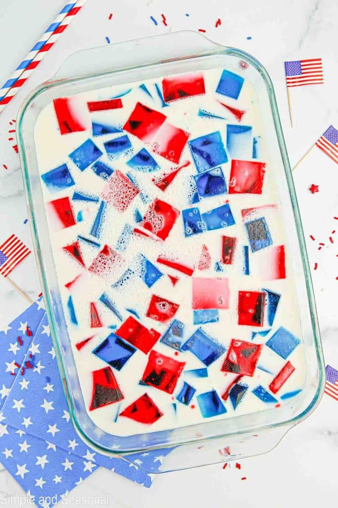 set broken glass jello in a pan with patriotic decorations