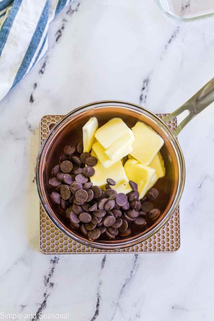 butter and dark chocolate chips in a saucepan