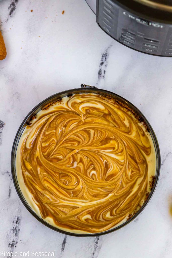 cookie butter swirled into cheesecake batter