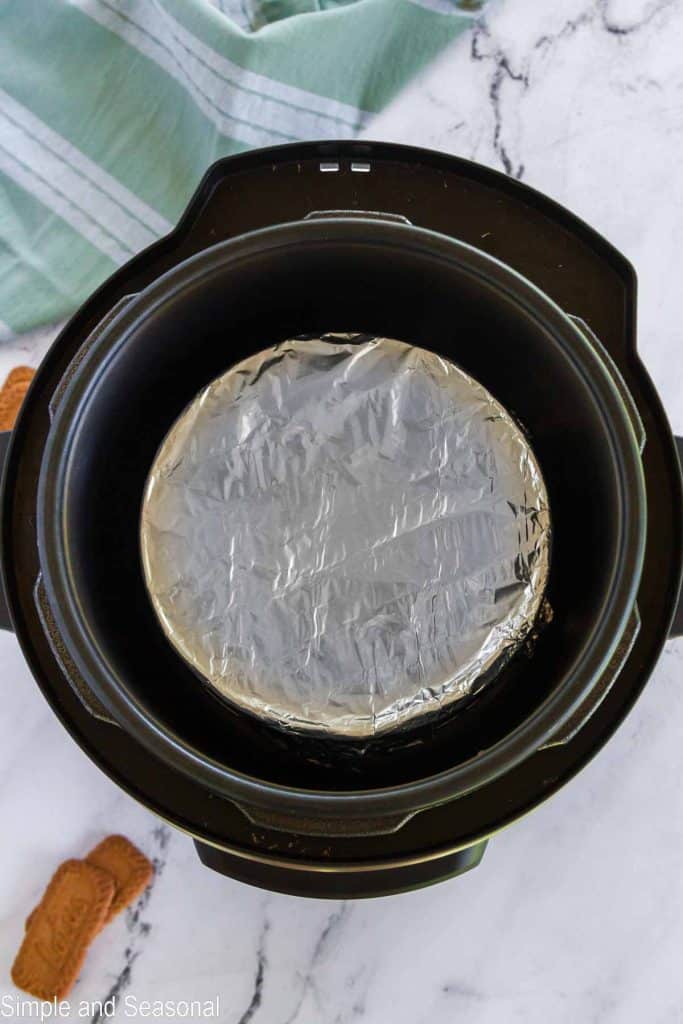 pan covered in foil and placed inside pressure cooker