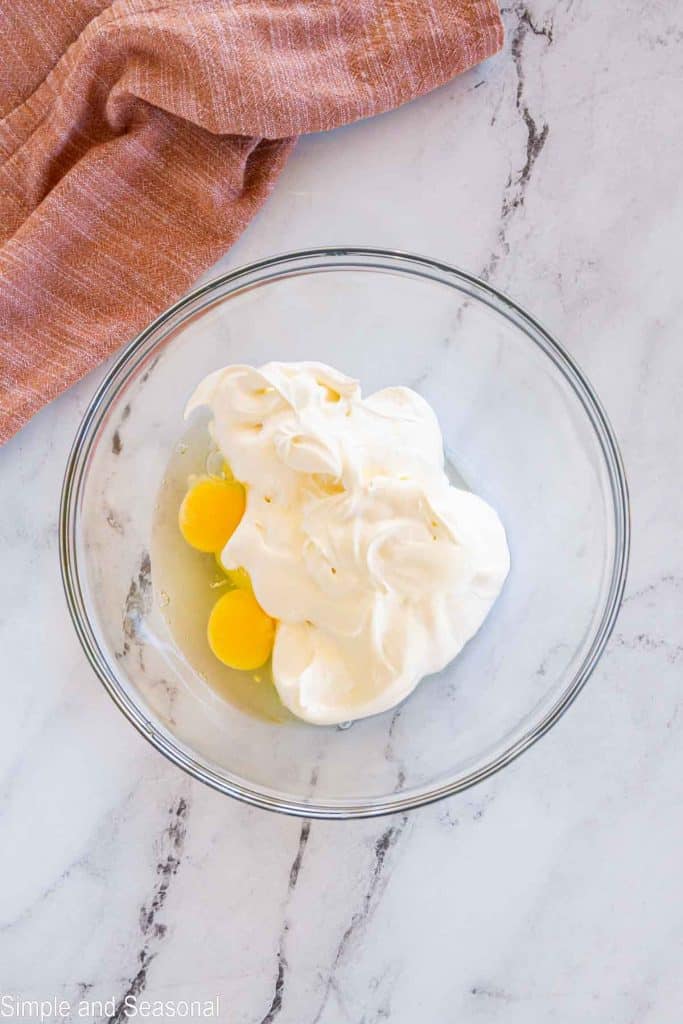 cool whip and eggs in a bowl