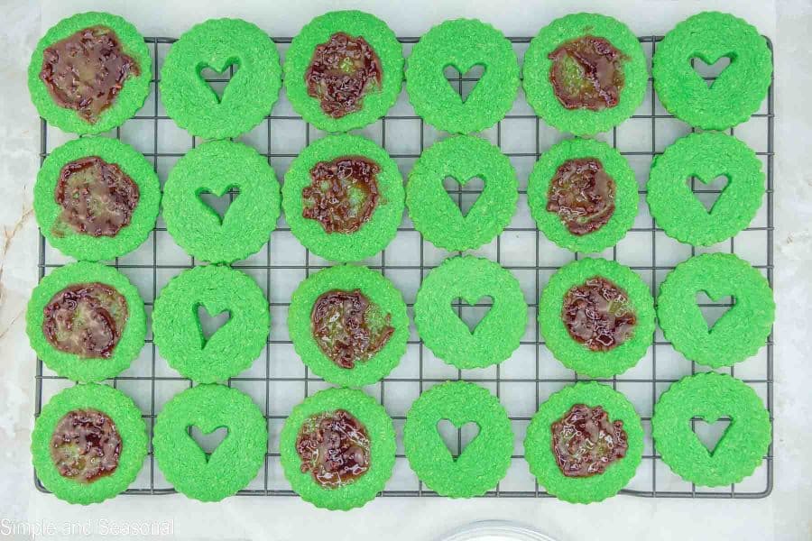 cookies with raspberry spread on one side and heart cutout on the other