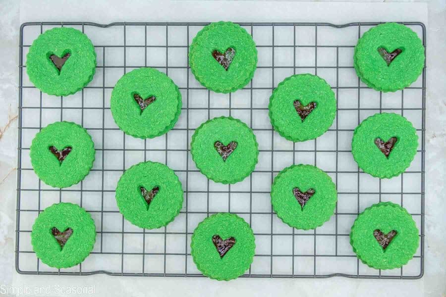green Grinch Linzer cookies sandwiched together