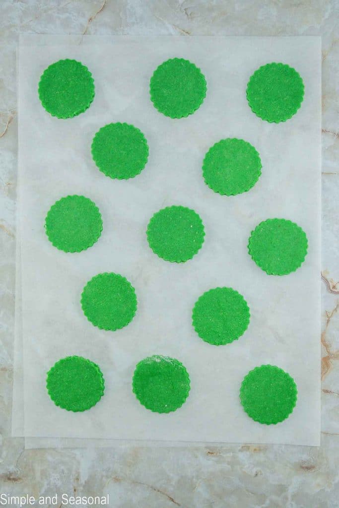 green cookies cut out with scalloped edges