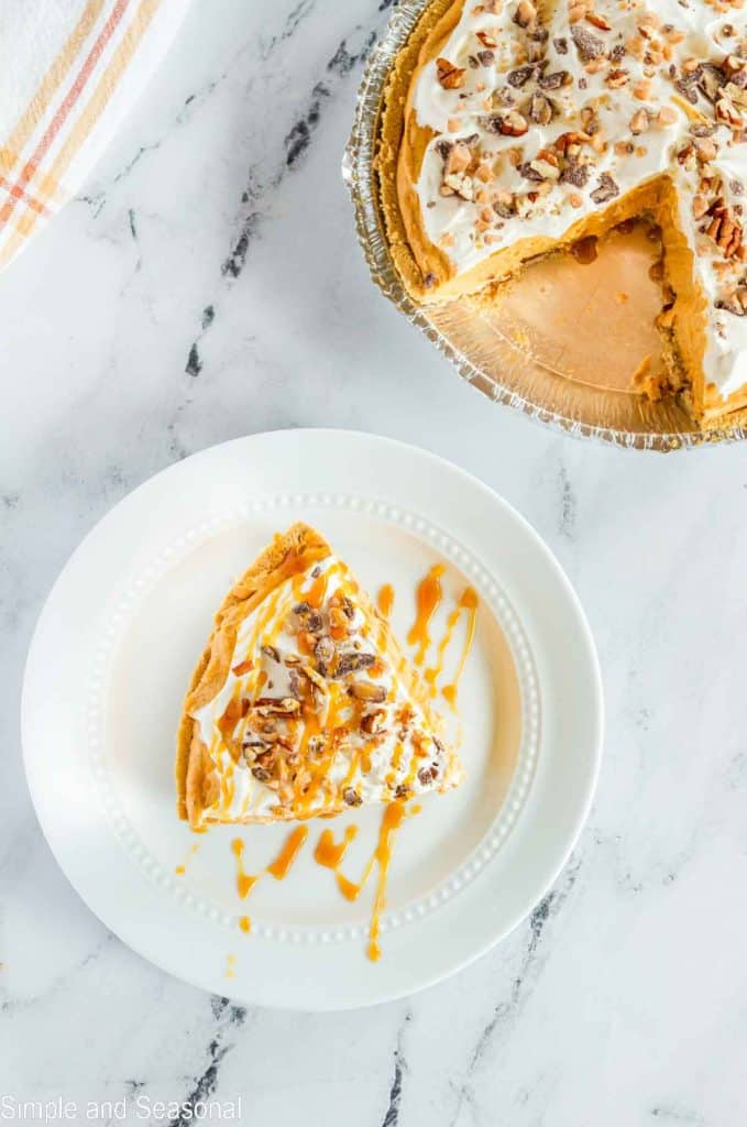 slice of pie on a plate drizzled with caramel