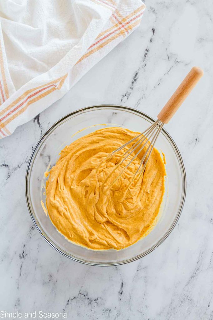 pumpkin layer in a bowl with whisk