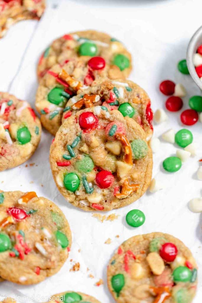 cookie with chunks of chocolate, pretzels, sprinkles and peanuts baked inside