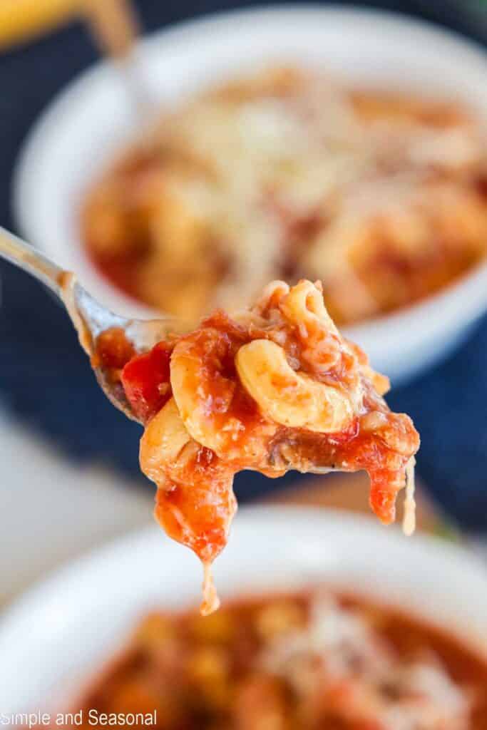 spoonful of lasagna soup with melty cheese