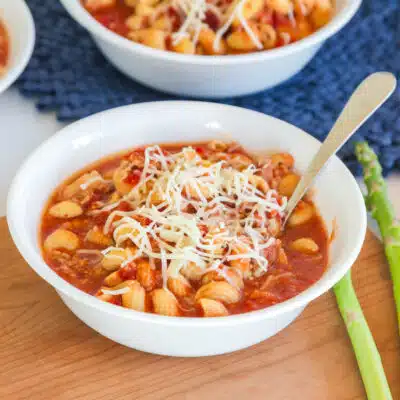 close up view of white bowl filled with lasagna soup made in the crockpot
