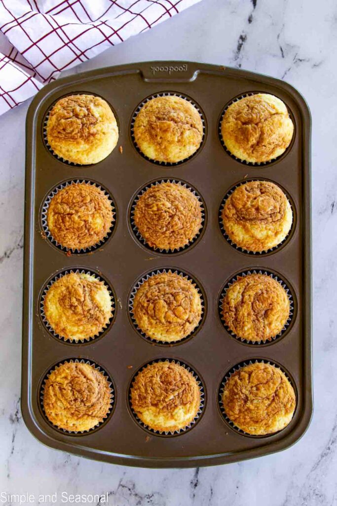 baked cookie butter cupcakes in the cupcake pan