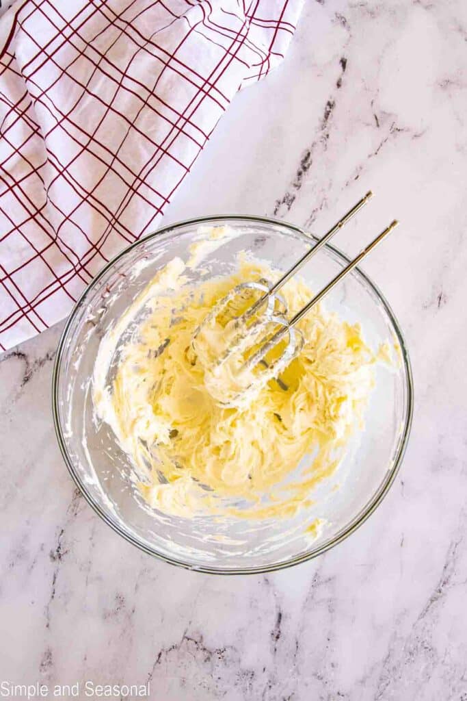 cream cheese and butter creamed together in a bowl
