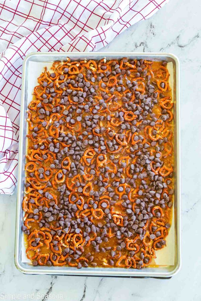 chocolate chips sprinkled over toffee pretzel mixture