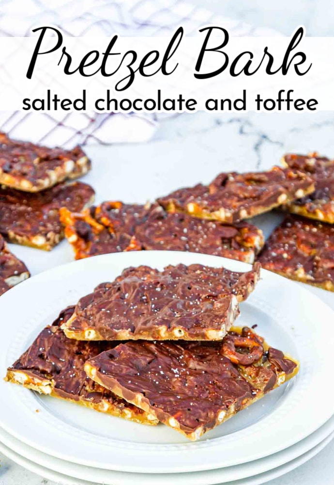 pretzel bark squares topped with salt and stacked on white plates; text overlay reads: Pretzel Bark-salted chocolate and toffee.