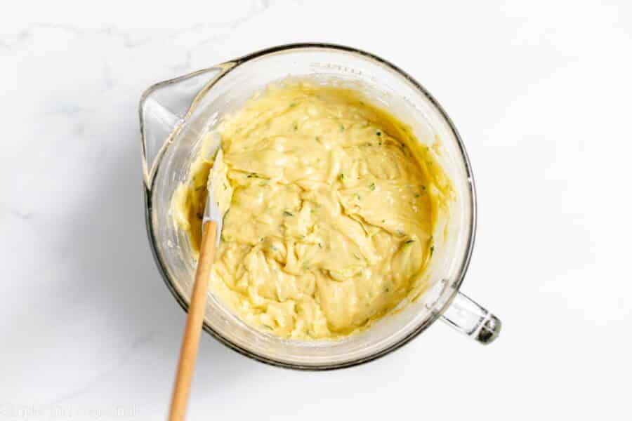 spatula mixing together wet and dry ingredients