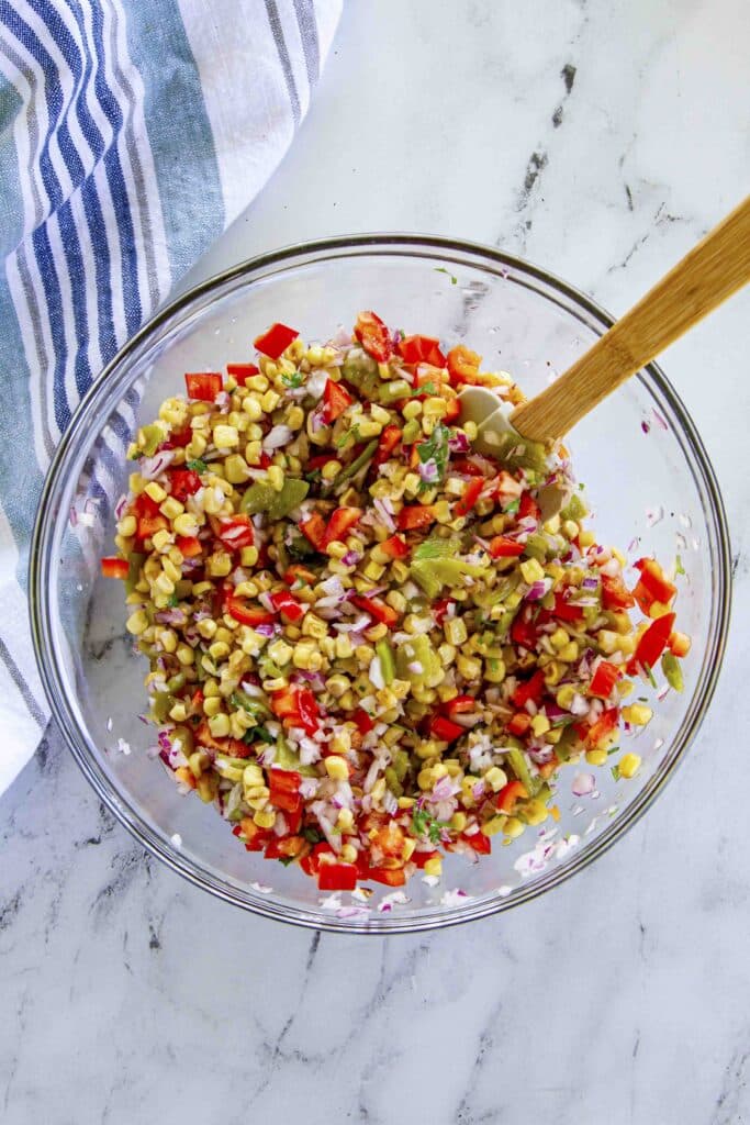 corn salsa or corn salad mixed together in a bowl