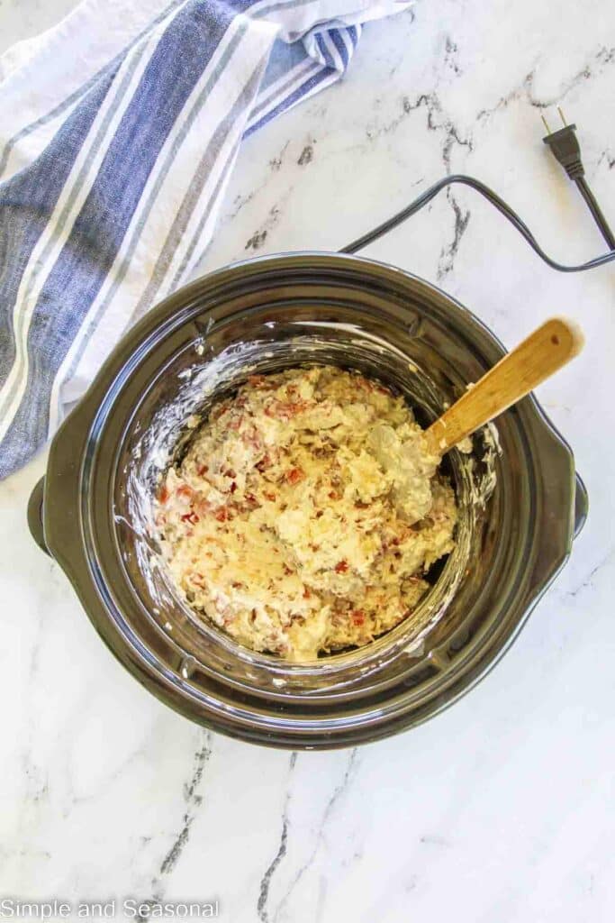 uncooked ingredients in the slow cooker crock