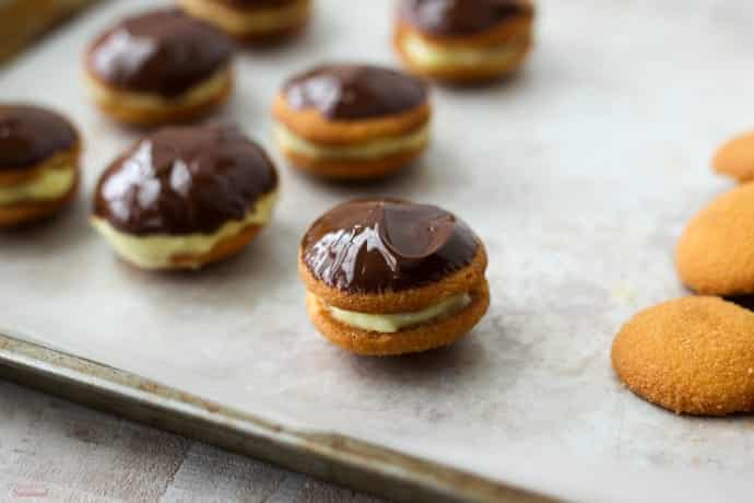 freshly dipped cookies on tray to set